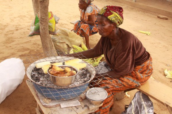 Woman-Cooking-Corn