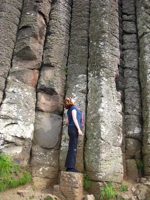 Looking up at the tall rocks at Giant's Causeway