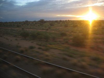 sunset over the outback as seen from The Ghan train