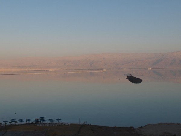 The Dead Sea reflecting the horizon and sky above