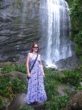 Nora Dunn, The Professional Hobo, in front of a beautiful Waterfall in Grenada