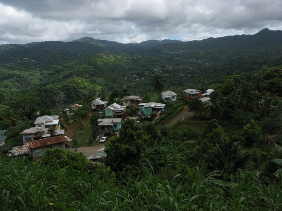 As we climb ever-higher, colourful little communities impossibly poke out of the dense rainforest