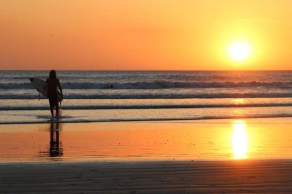 sunset in Lima with surfer