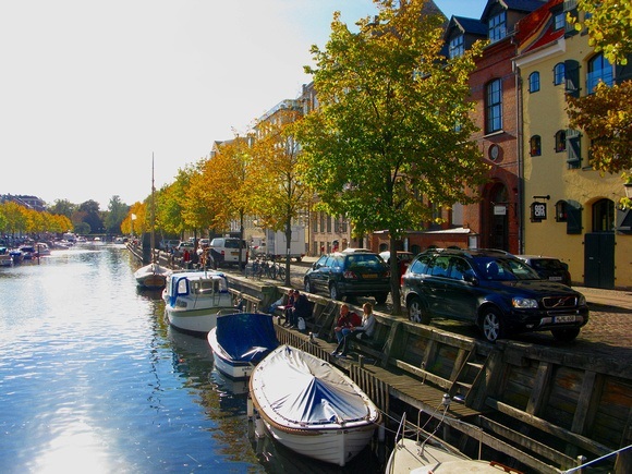 Copenhagen waterway with colourful trees and sunshine