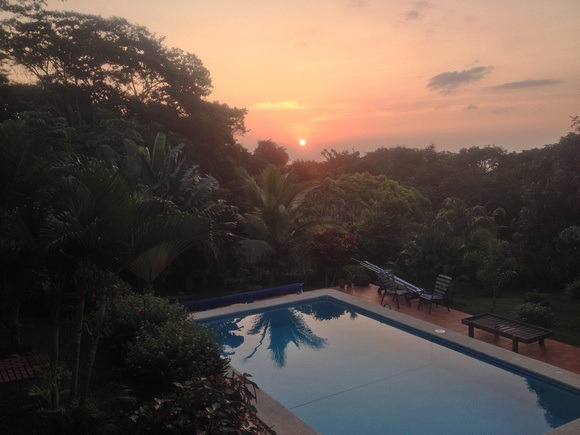 sunset over a pool in Panama in an expat neighbourhood