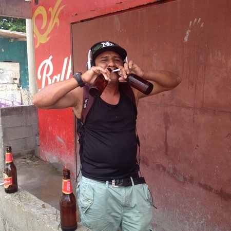 drinking out of two beer bottles simultaneously in Panama
