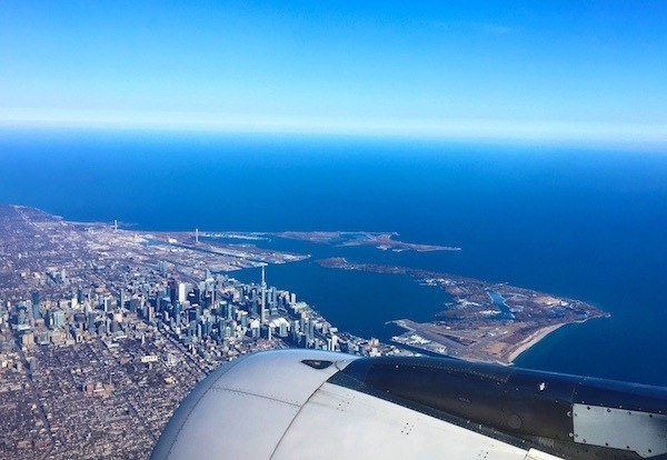 Flying over downtown Toronto, with Mystery Shopping Airfare