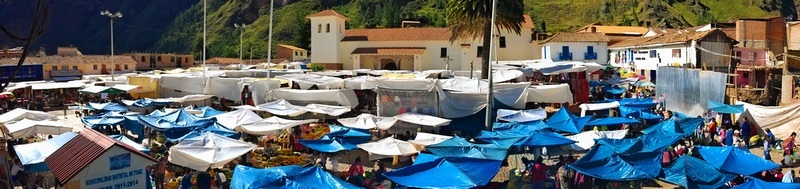 Panorama of Pisac Market from above, with blue tarp roofs