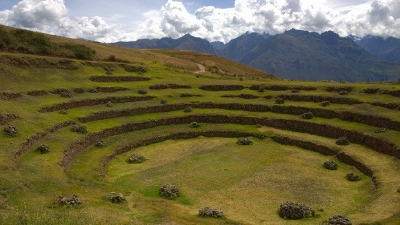 small rock piles scattered around the Incan ruins of Moray in Peru