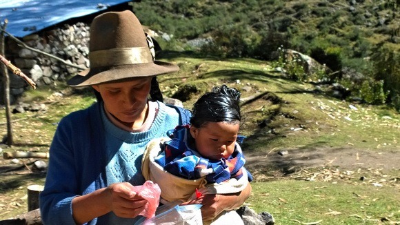 Woman and baby from Badacancha, taking our donations