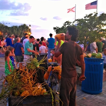 selling coconuts in Key West at the Sunset Celebration