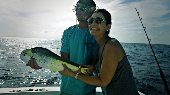 catching a fish while deep sea fishing