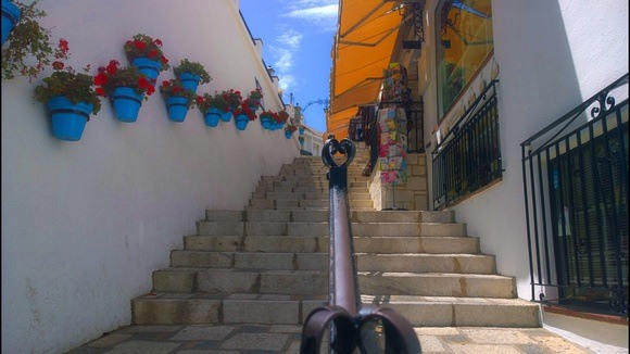 Mijas Pueblo staircase lined with blue flower pots