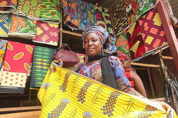 Woman at NWC selling her colourful fabric in Kigali Rwanda