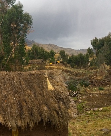 heavy rain blowing over a Quechua community