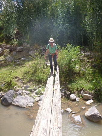 Nora Dunn, The Professional Hobo, hiking across a long on the way up to Pisac Ruins