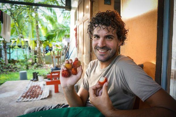 Antonio of The Adventure Junkies, with strawberries in Costa Rica