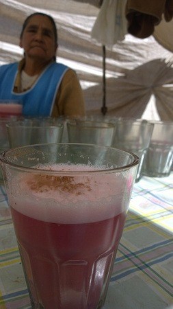 A glass of chicha at a street food market in Peru