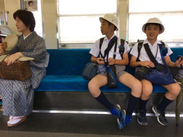 on a Tokyo train: all kinds of uniforms