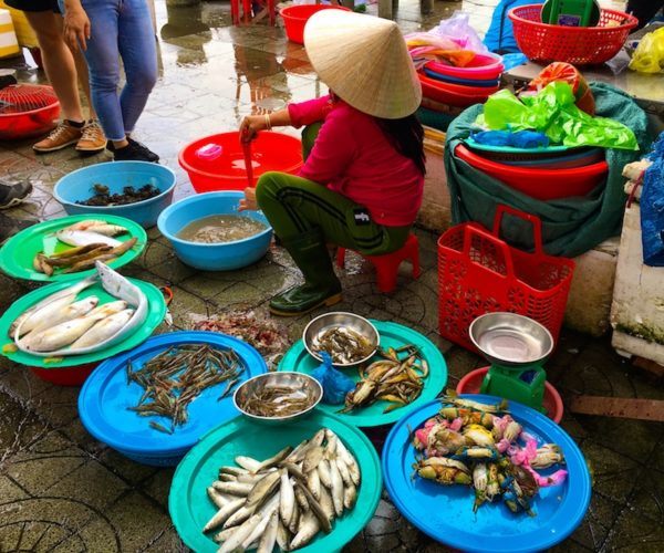 Hoi An street vendor selling fish