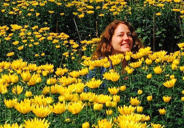 enjoying life in yellow flowers, while learning  various truths about travel