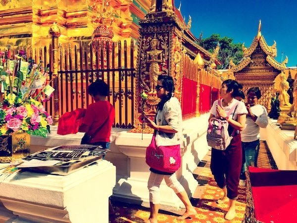 Praying at a Chiang Mai temple; the irony of expat living