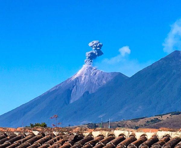 Volcan de Fuego in Antigua Guatemala, puffing smoke. Check the news for volcano alerts before you travel! 