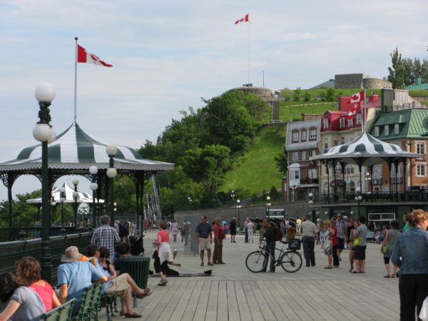 Mystery Shoppers with Shopping Bags in Quebec Chateau Frontenac boardwalk