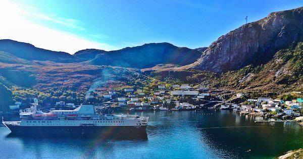 The town of Francois in Newfoundland, with Adventure Canada cruise boat in the foreground