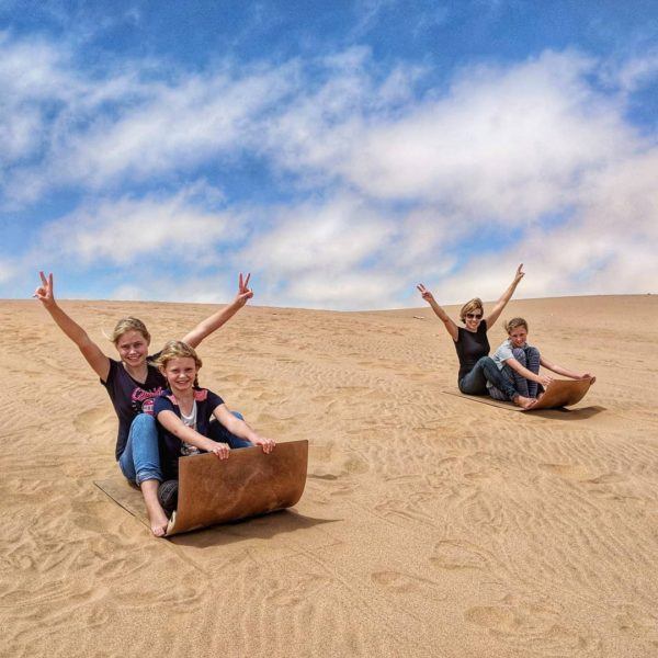The Pattons digital nomad family, sand boarding