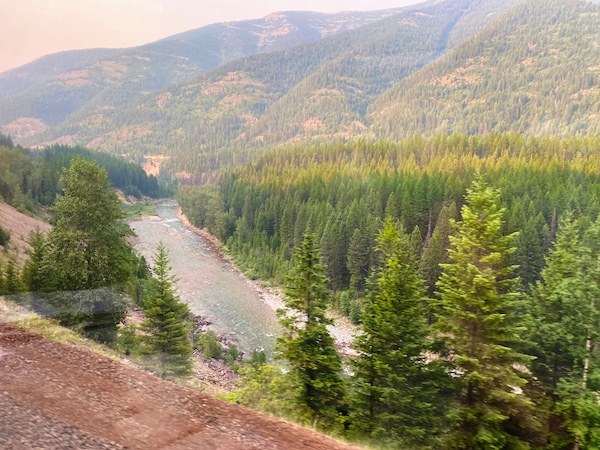 Taking the Amtrak Empire Builder train through the rocky mountains over rivers