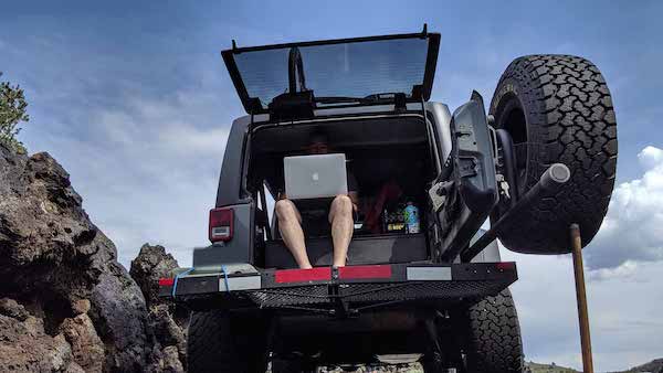 Jason Robinson working location independently out of a jeep after a career transition